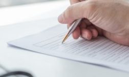 Applicant Filling In Company Application Form Document Applying Applicant filling in company application form document applying for job, or registering claim for health insurance